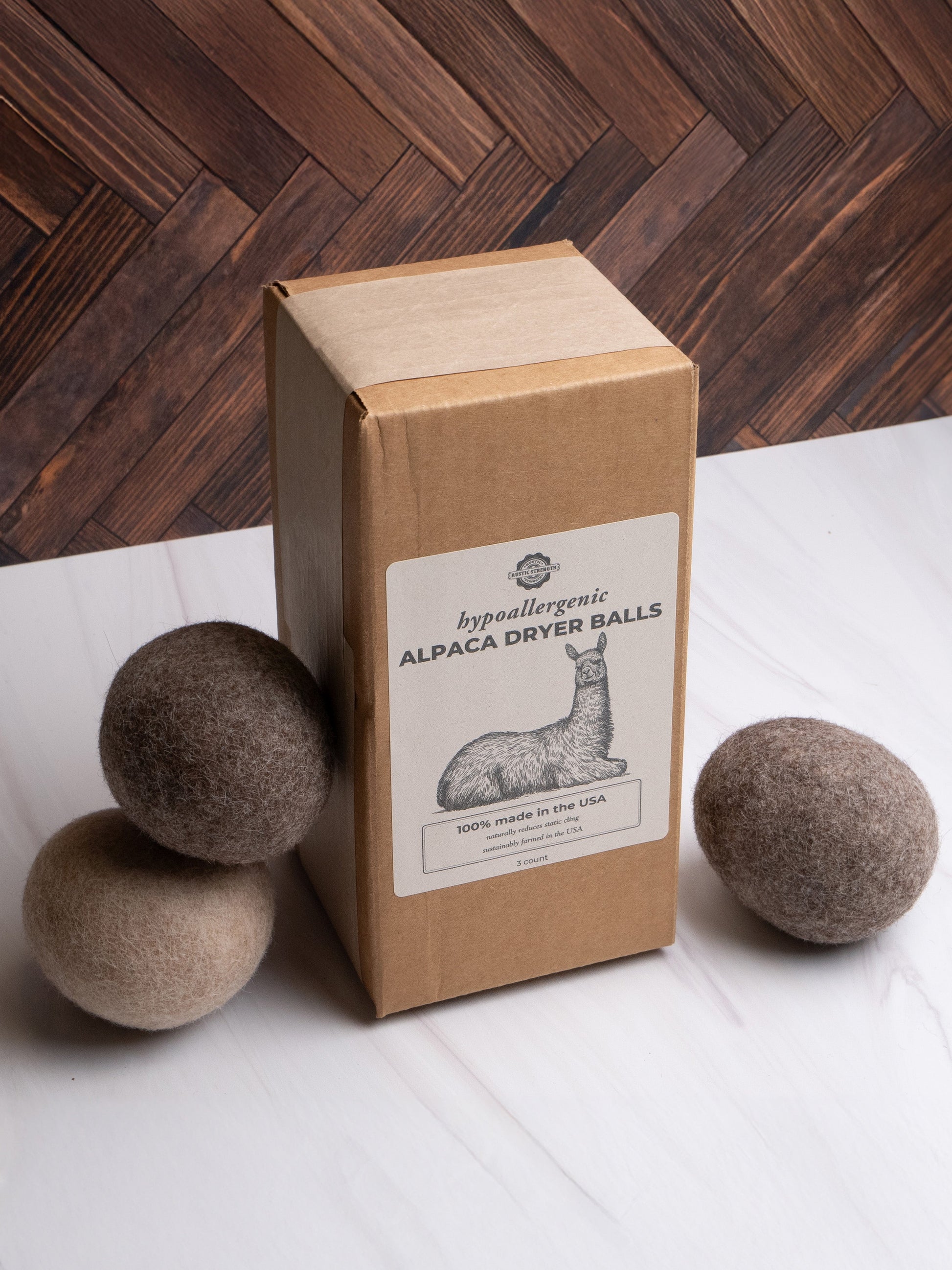 Rustic Strength alpaca laundry dryer balls, 3-pack, natural wool for static reduction and softening in laundry.