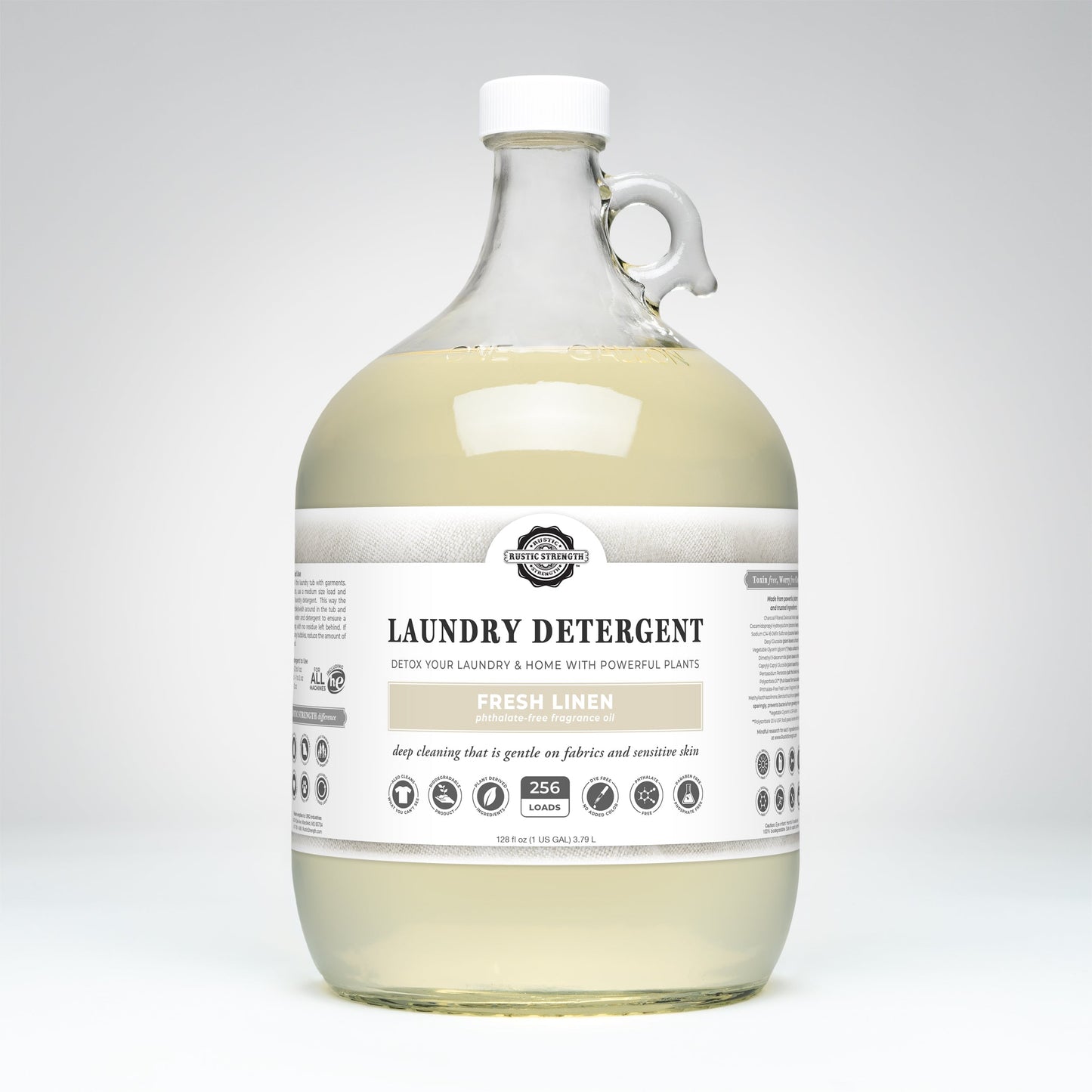 Rustic Strength Fresh Linen laundry detergent in a 24 oz glass bottle with a white cap, designed for clean, fresh-smelling laundry.