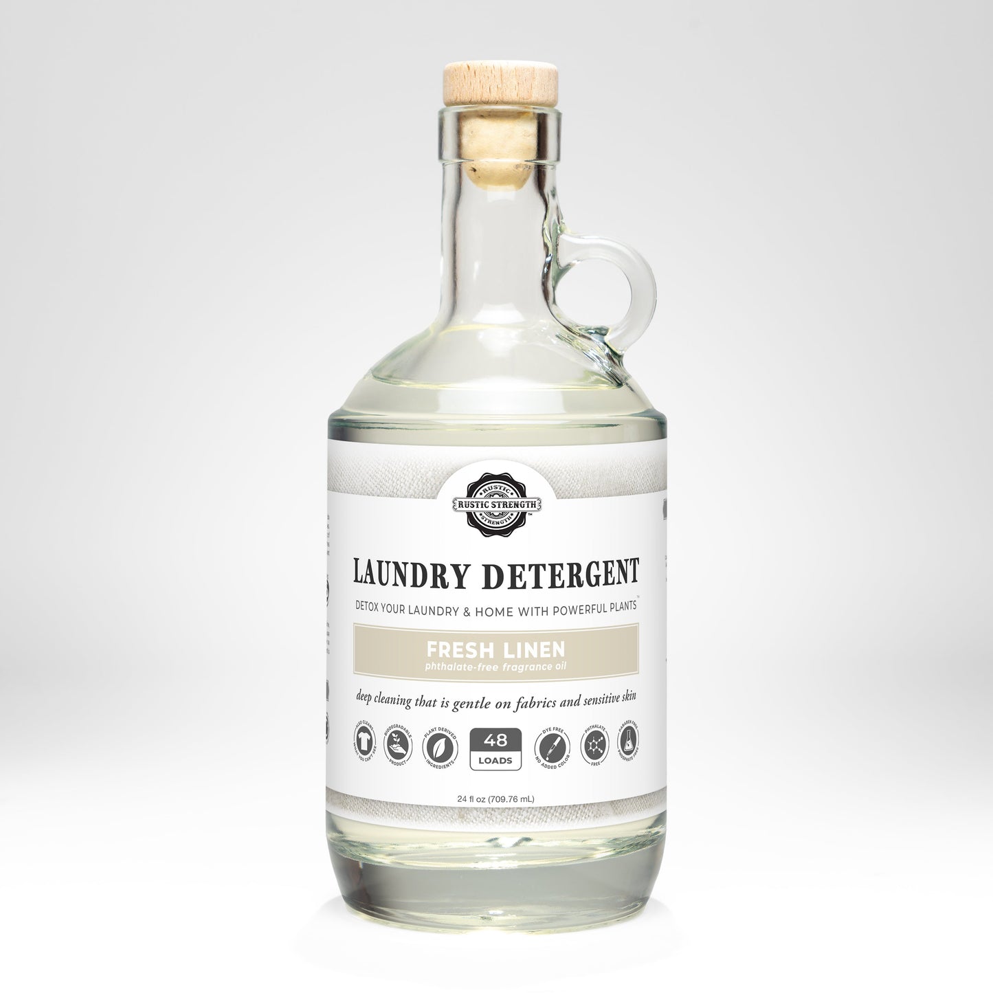 Rustic Strength Fresh Linen laundry detergent in a 24 oz glass bottle, showcasing the product with a clean and fresh scent.