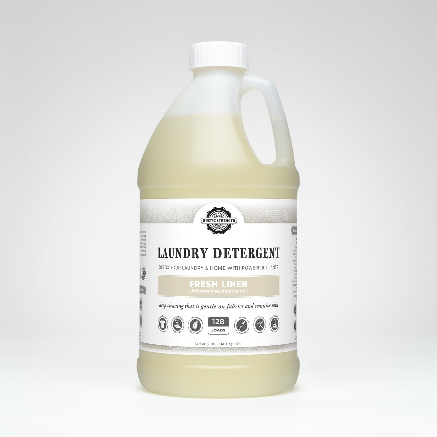 Rustic Strength Fresh Linen laundry detergent in a 24 oz glass bottle, showing the label and product packaging.