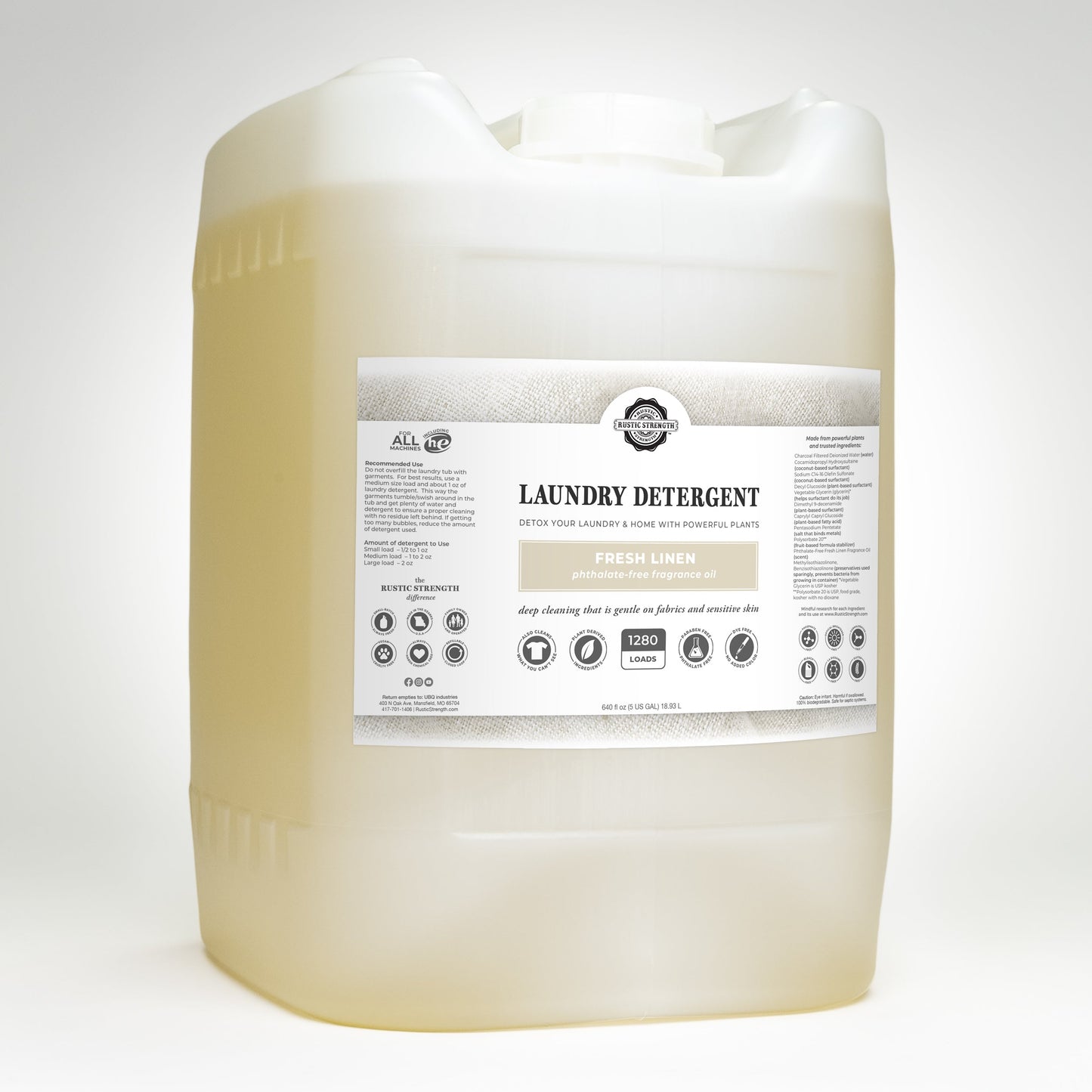 Rustic Strength Fresh Linen Laundry Detergent in a 24 oz glass bottle, showing the label and clear liquid inside.