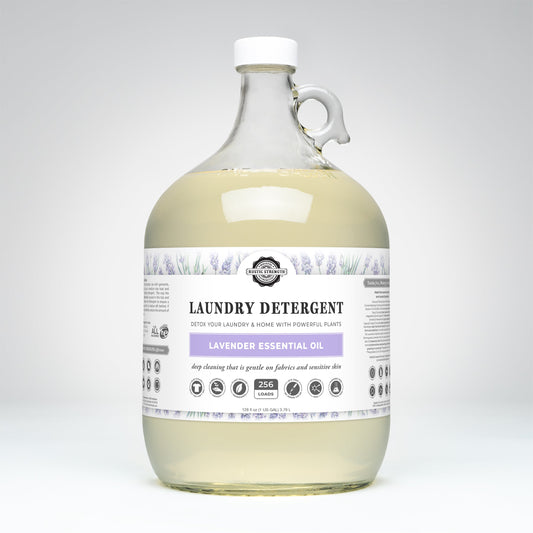 Rustic Strength lavender laundry detergent in a 24 oz glass bottle, showcasing the product with lavender scent and cleaning formula.