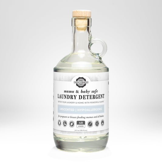 Rustic Strength laundry detergent in a 24 oz glass bottle, safe for mama and baby, gentle for delicate clothing and sensitive skin.