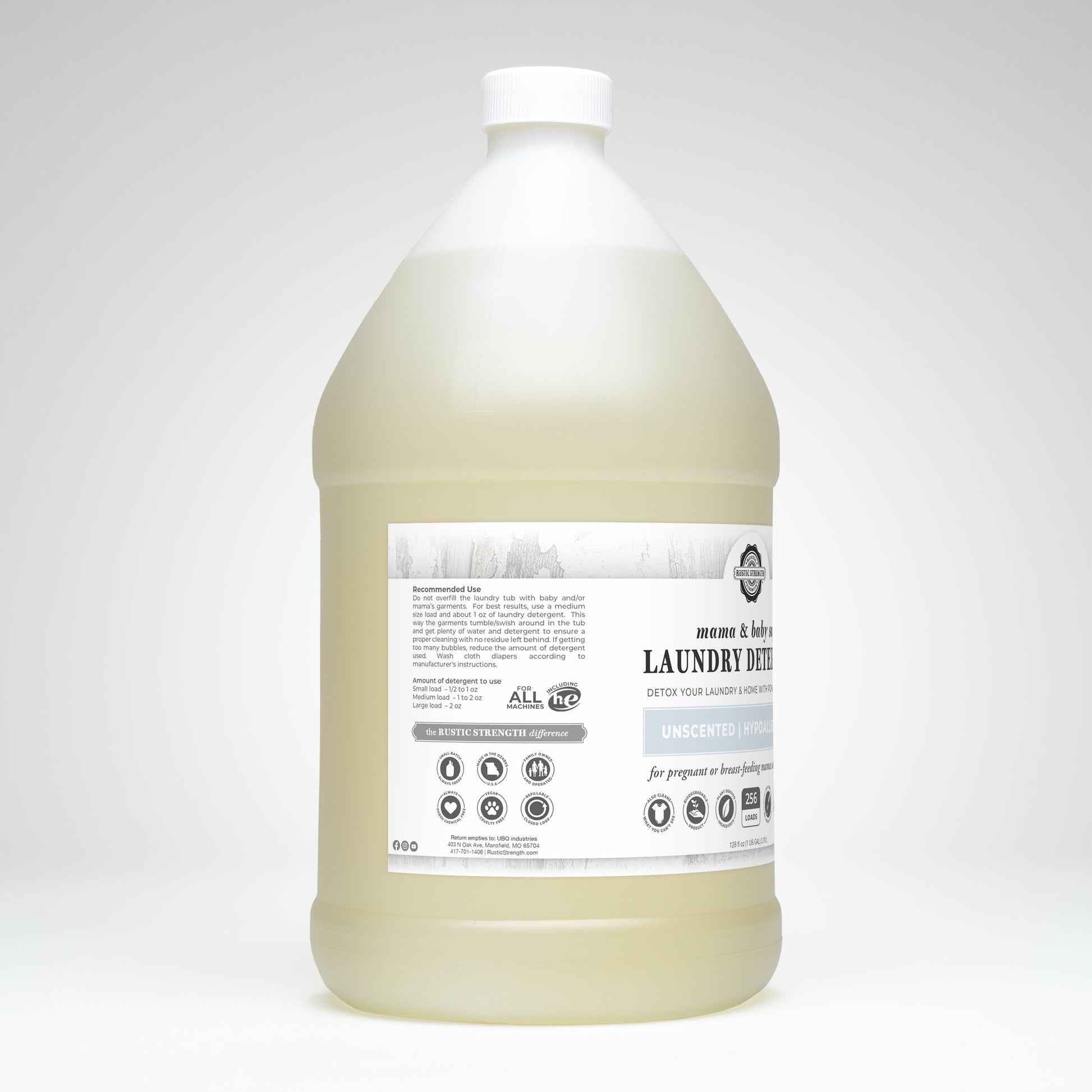 Rustic Strength laundry detergent in a 24 oz glass bottle, safe for Mama and baby, with gentle cleaning formula for delicate fabrics.