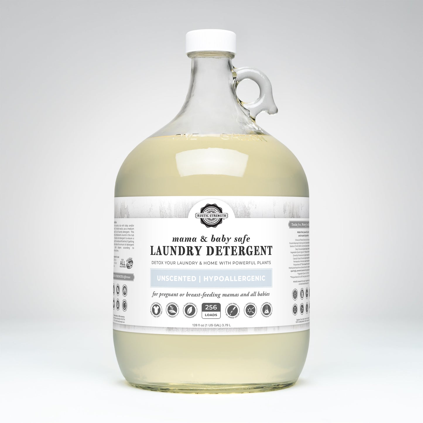 Rustic Strength laundry detergent in a 24 oz glass bottle, safe for mama and baby, gentle cleaning for delicate clothes.