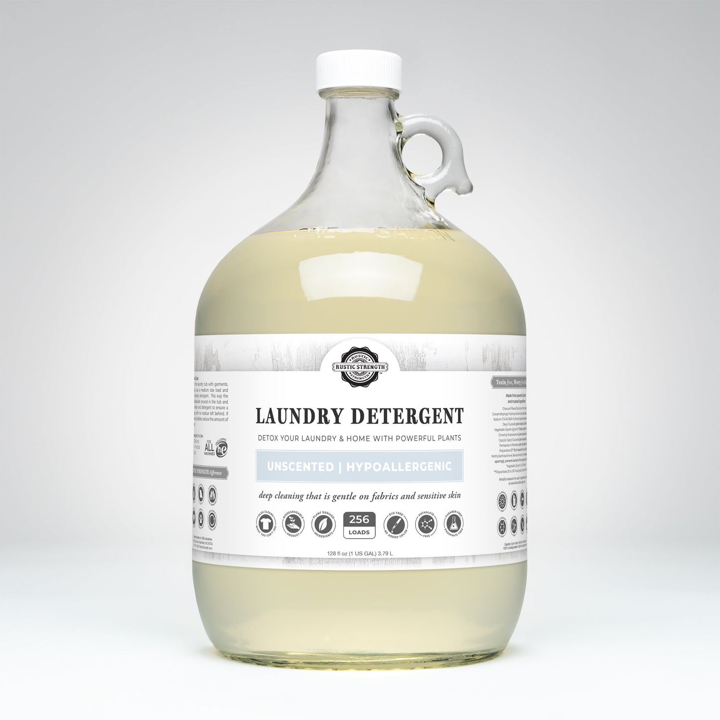 Rustic Strength unscented laundry detergent in a clear 24 oz glass bottle, suitable for gentle laundry cleaning.