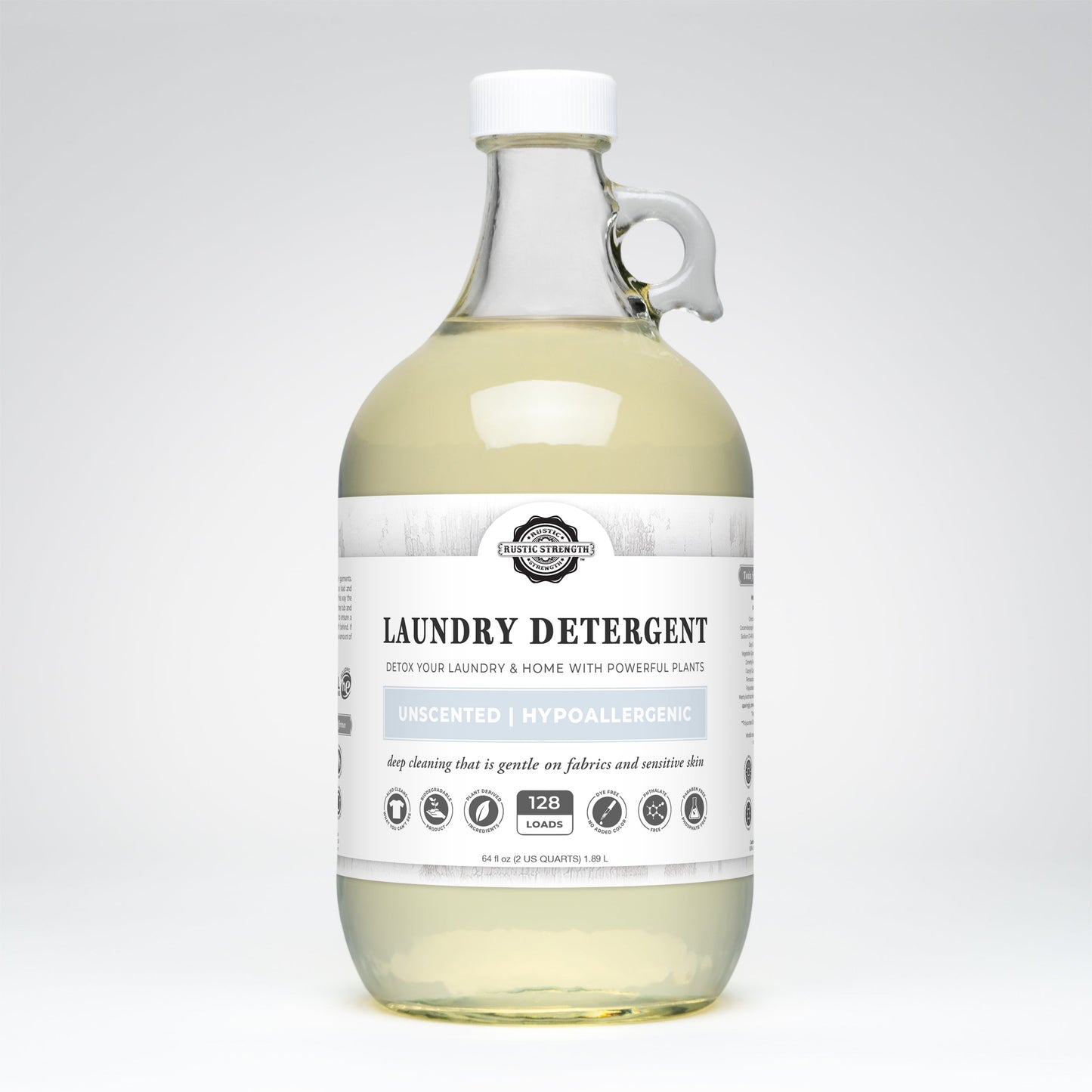 Rustic Strength unscented laundry detergent in 24 oz glass bottle, showing the product label and packaging for gentle cleaning.