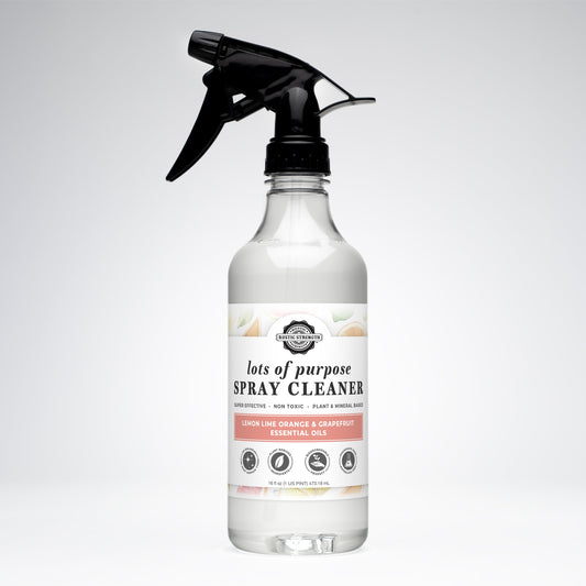 Rustic Strength multi-purpose spray cleaner in 16 oz bottle with lemon, lime, orange, and grapefruit scent, ready for cleaning tasks.