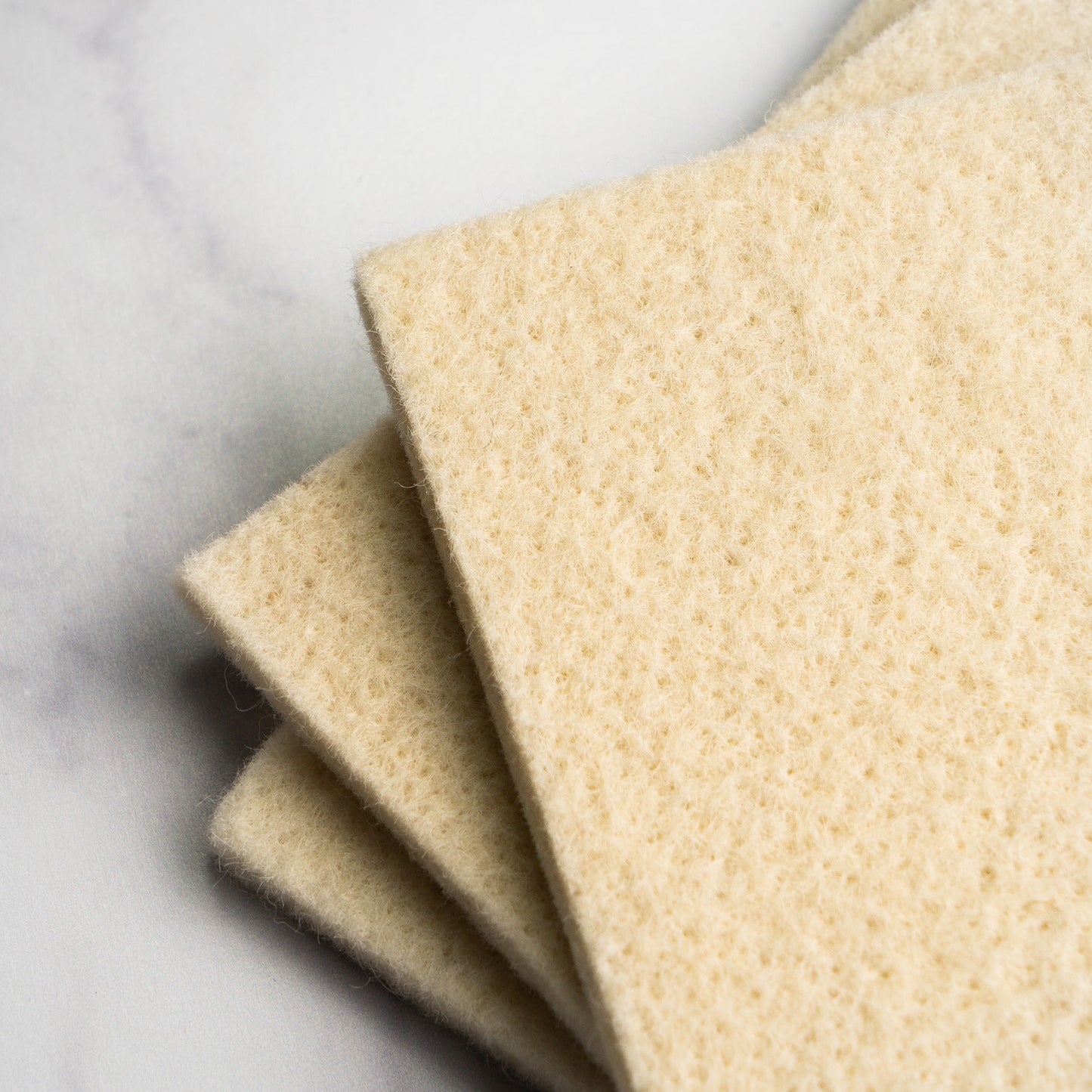 Rustic Strength sustainable wool scrub for multi-purpose cleaning, showing a close-up of the eco-friendly wool cleaning pad.