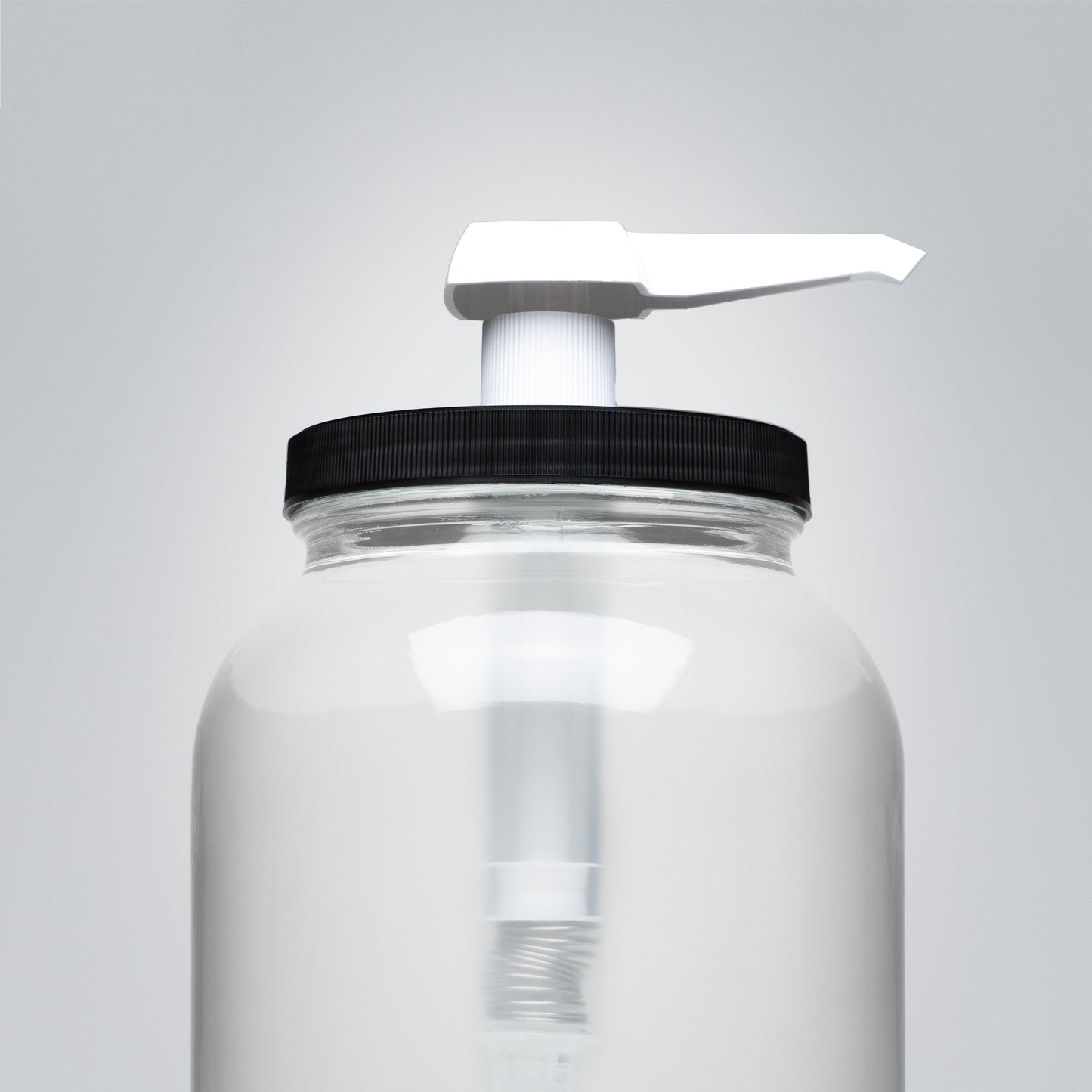 Rustic Strength 1 Gallon Wide Mouth Jar Measuring Pump showing black pump nozzle attached to a glass jar for liquid dispensing