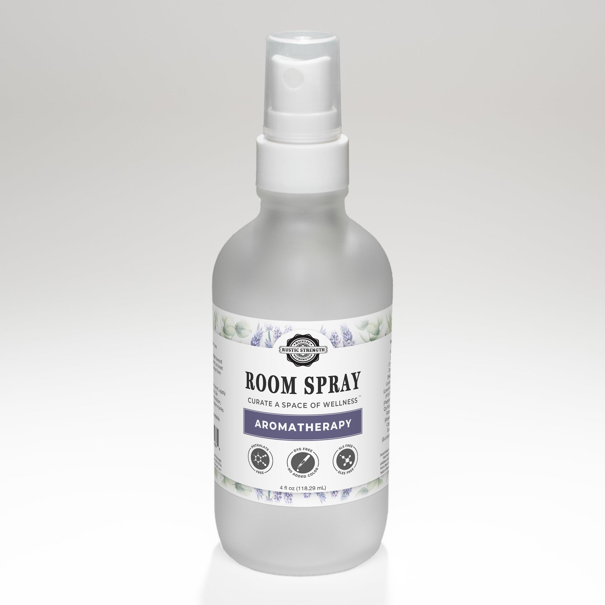 Rustic Strength aromatherapy room spray with a sleek glass bottle and spray nozzle, designed to freshen and scent indoor spaces.