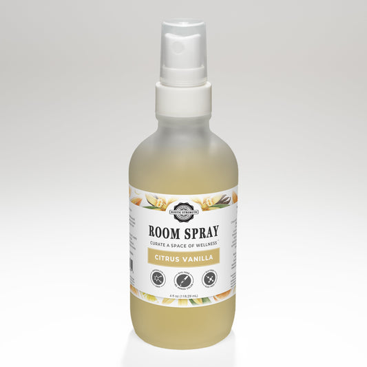 Rustic Strength Citrus Vanilla Room Spray bottle with spray nozzle, featuring a label with citrus and vanilla scents.