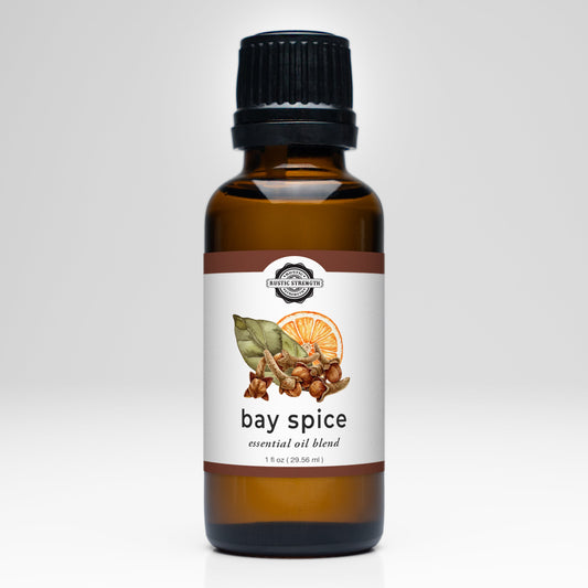 Rustic Strength Bay Spice Essential Oil Blend scent bottle with a natural label and cap, showcasing the aromatic oil inside.