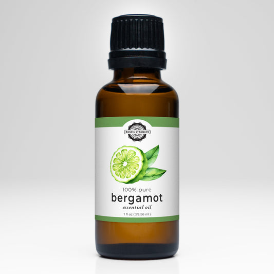 Rustic Strength bergamot essential oil scent bottle with a clear glass container and natural citrus fragrance.