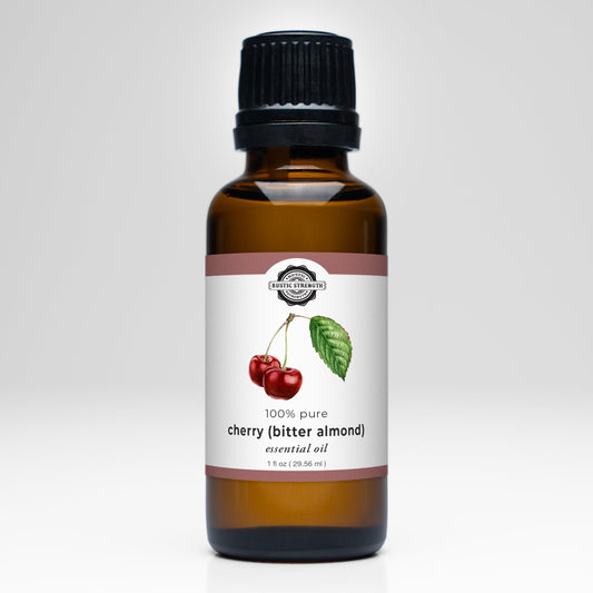 Bottle of Rustic Strength Cherry (Bitter Almond) Essential Oil, scented oil with rich cherry and almond aroma, in a dark glass bottle.