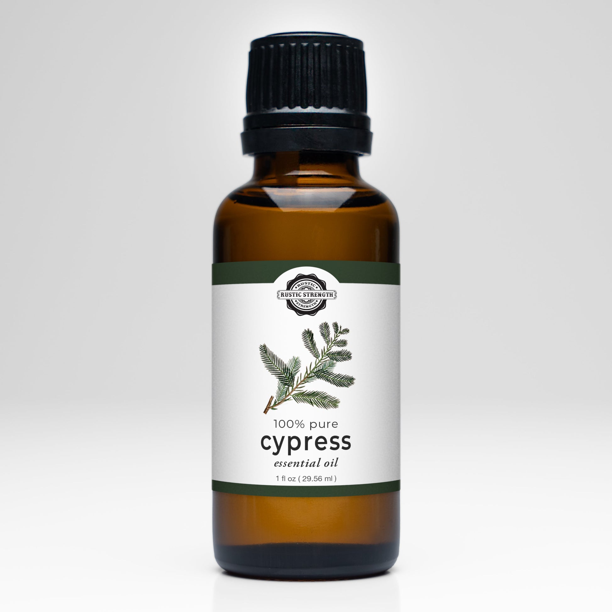 Rustic Strength Cypress Essential Oil scent bottle, clear glass container with white cap and label, showcasing natural aromatic oil.