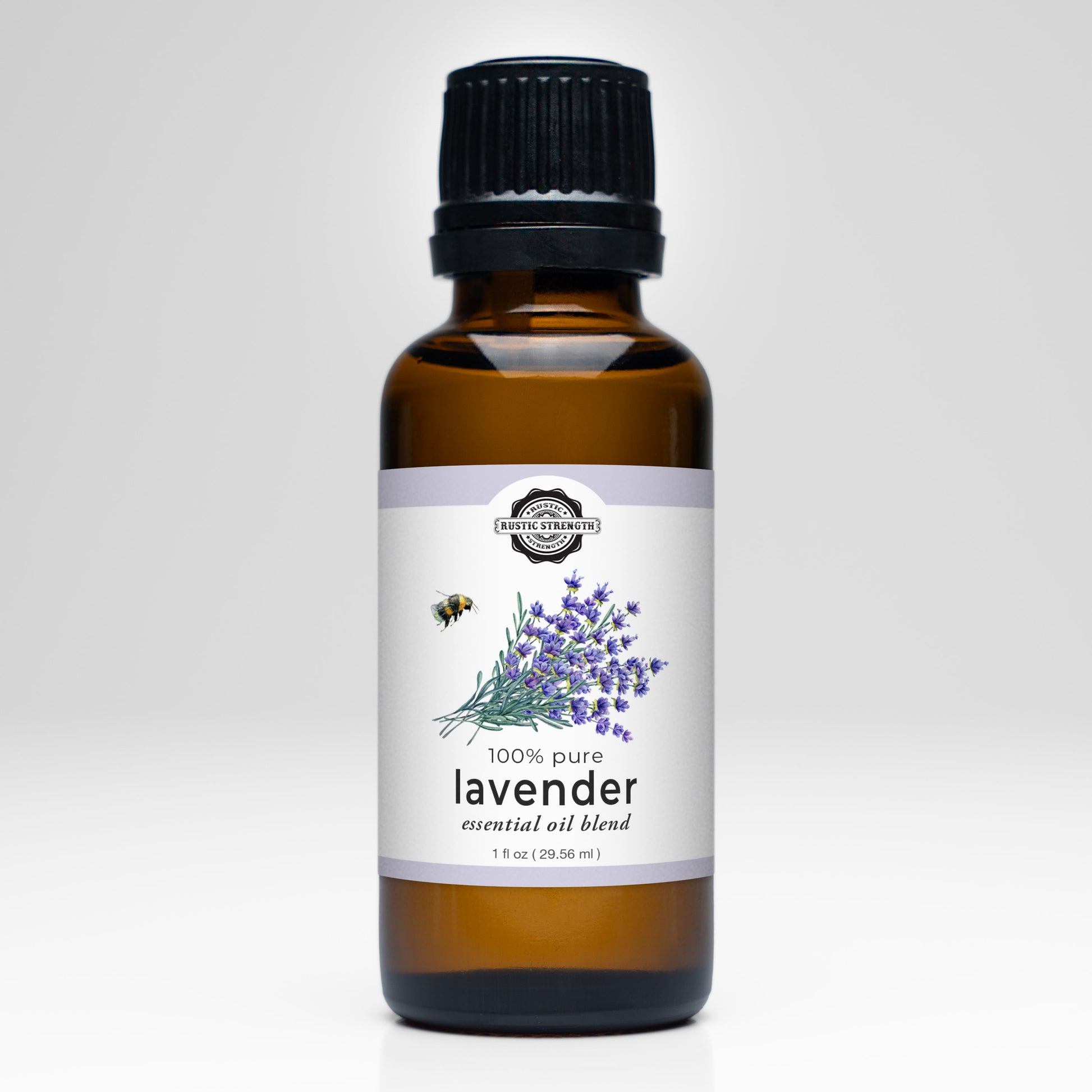 Rustic Strength Lavender Essential Oil scent bottle, clear glass container with lavender-colored label, aromatic natural essential oil.