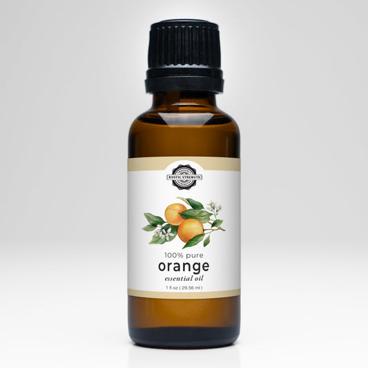 Rustic Strength orange essential oil scent bottle, golden-orange liquid in a glass container for aromatherapy and natural fragrance.