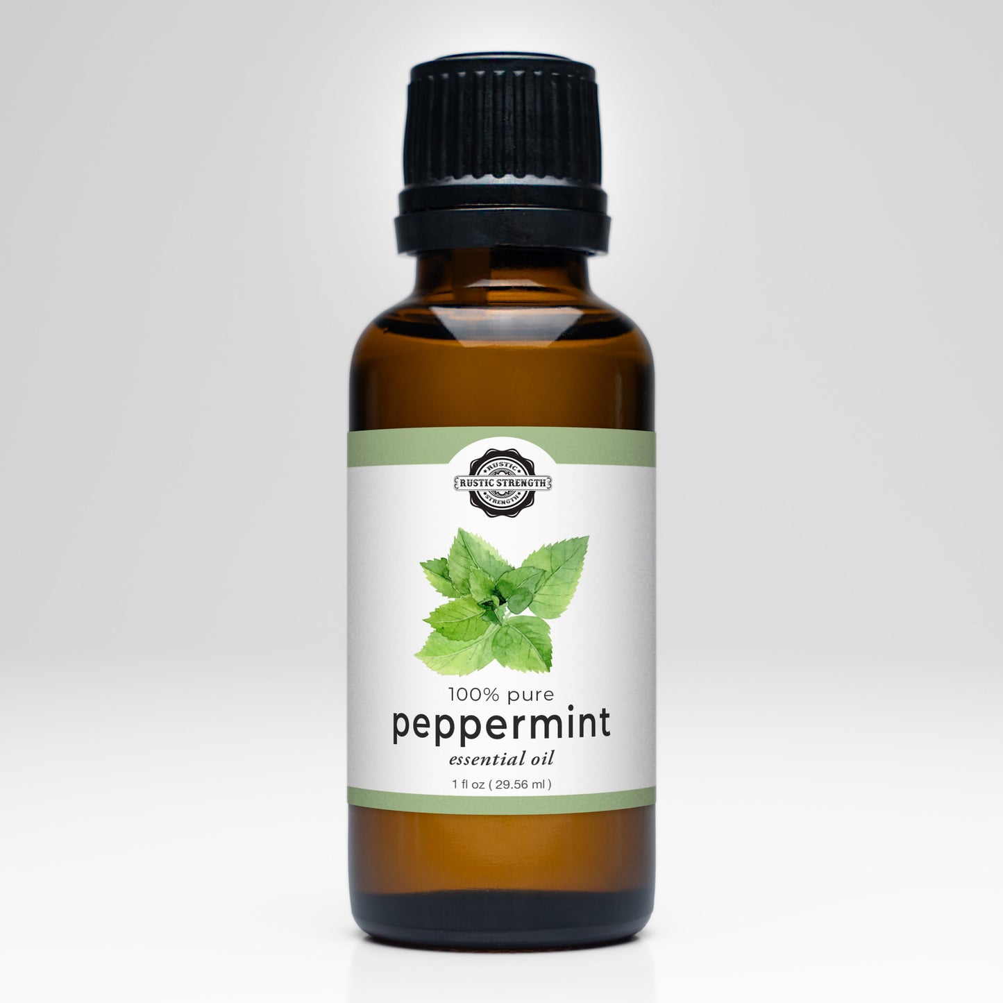 Rustic Strength peppermint essential oil scent bottle with a clear glass container and white cap, showcasing fresh mint aroma.
