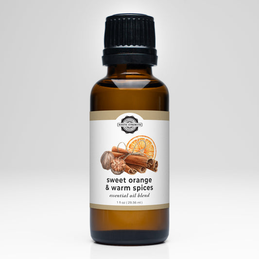 Rustic Strength Sweet Orange and Warm Spices essential oil scent blend in a glass bottle with a natural wooden cap.