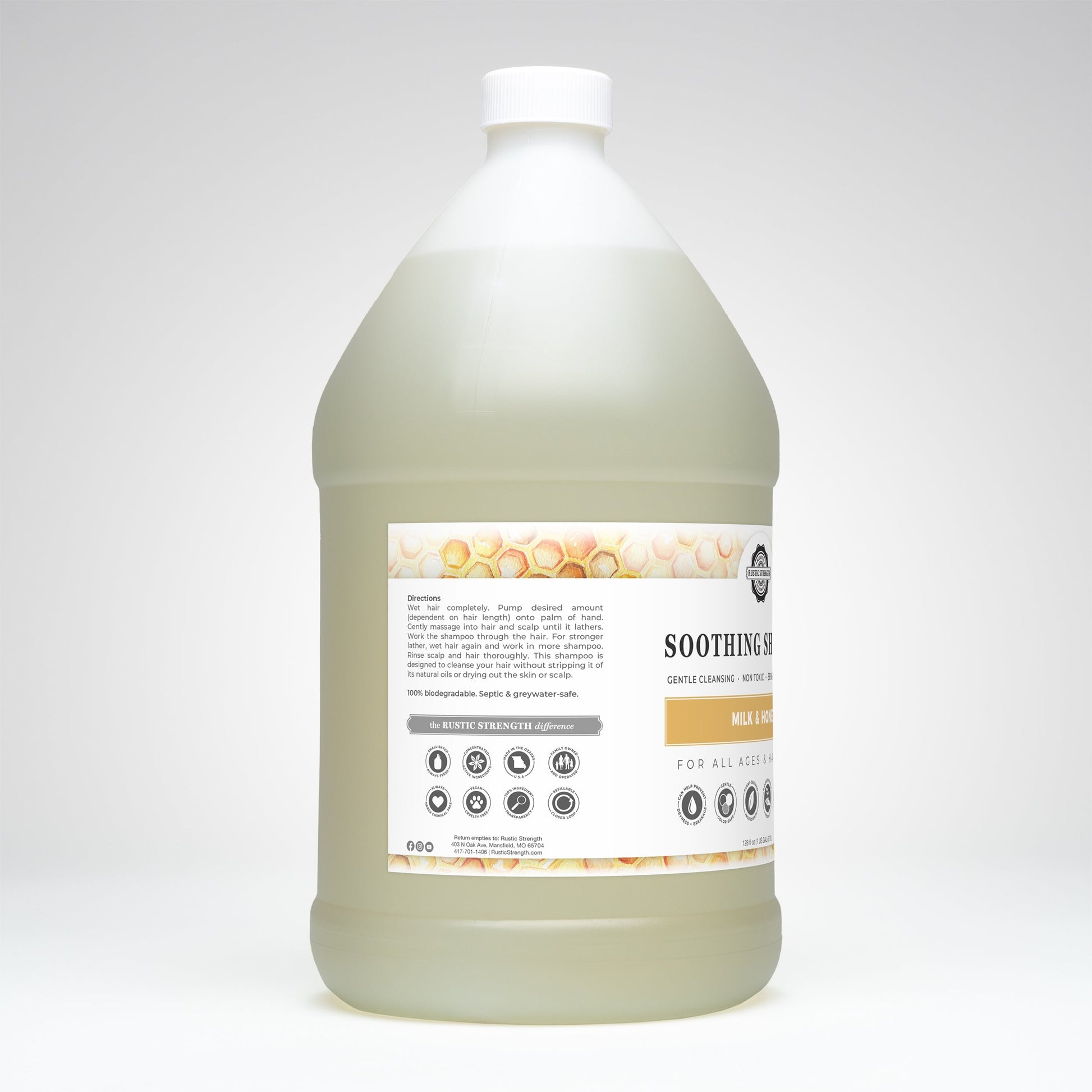 Rustic Strength soothing shampoo with milk and honey in a 16 oz bottle, showing the shampoo's creamy texture and natural ingredients.