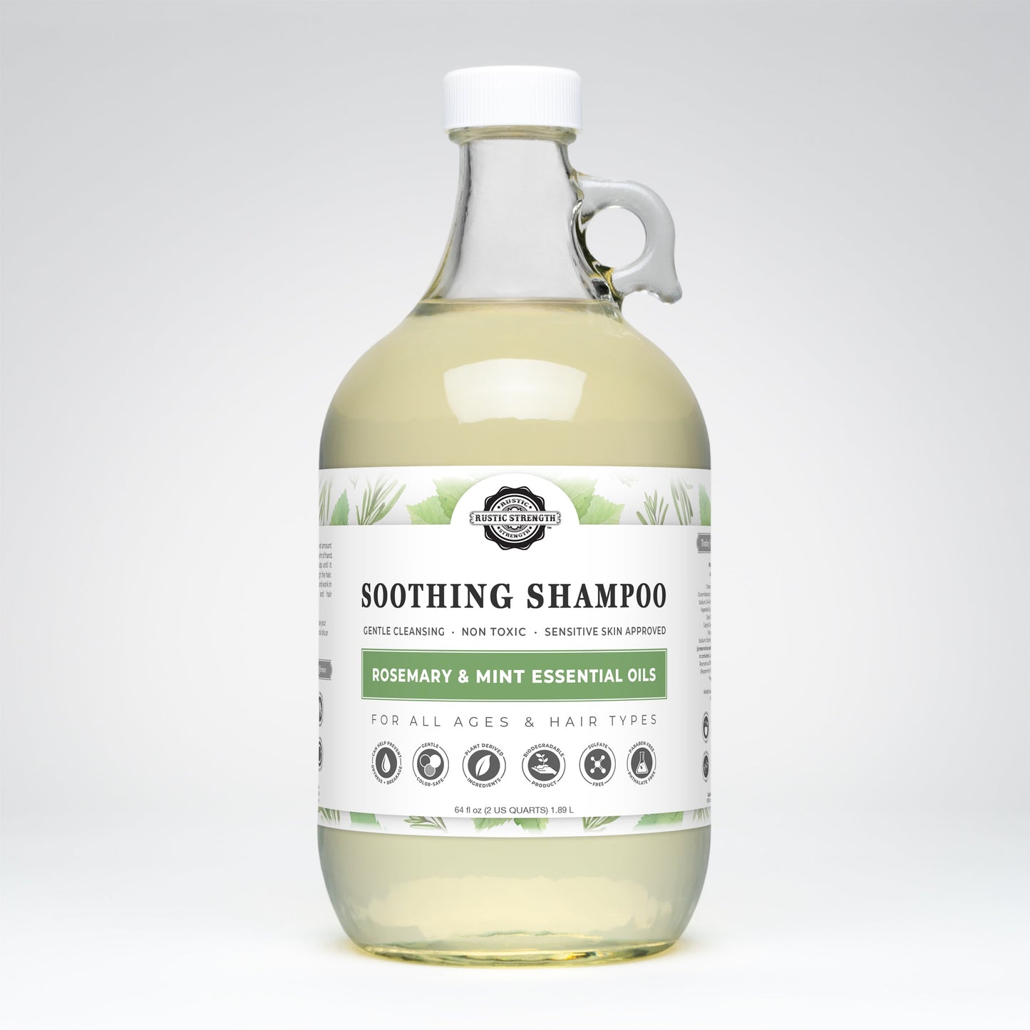 Rustic Strength Soothing Shampoo with rosemary and mint, 16 oz bottle, showing the label and fresh herbal ingredients.