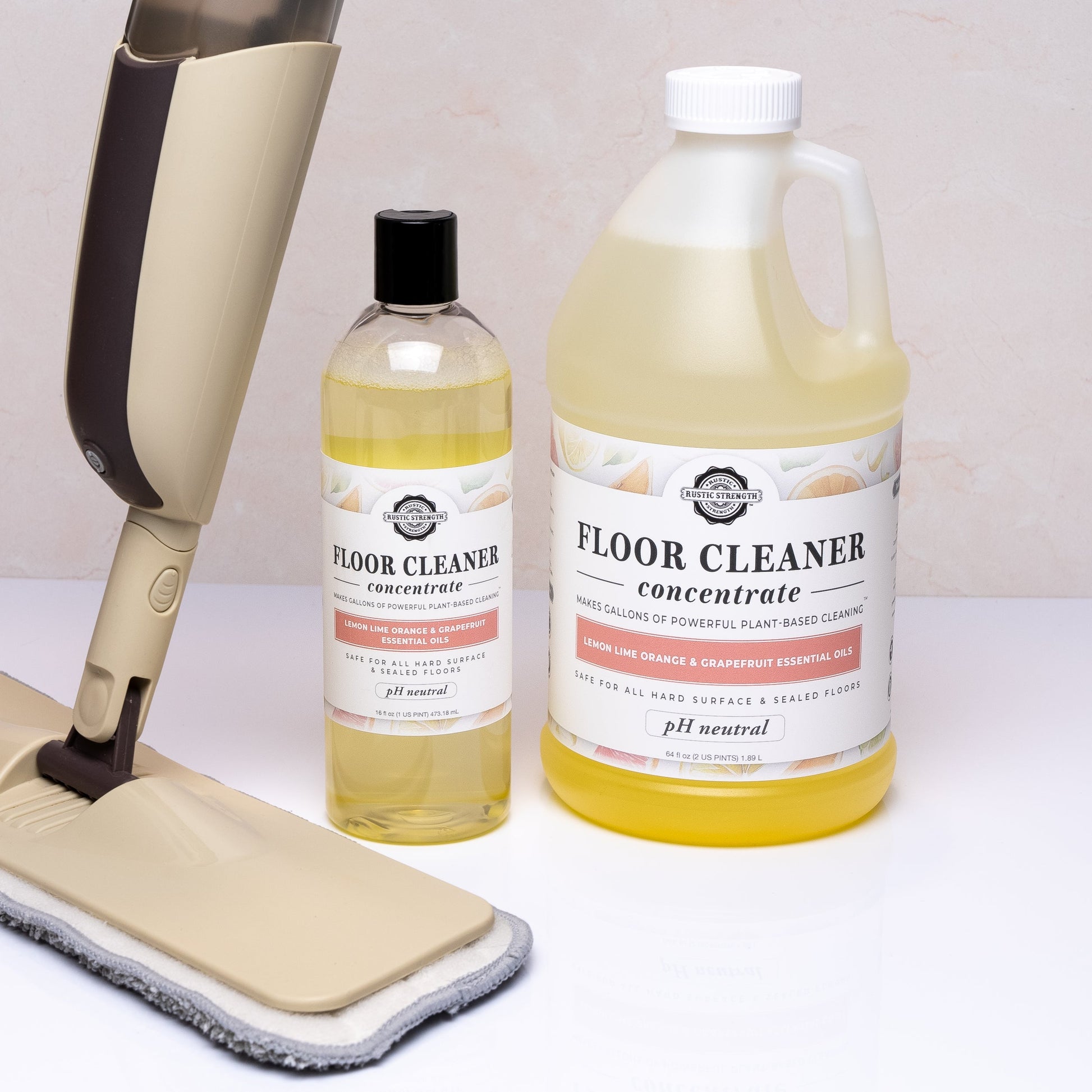 Rustic Strength 16 oz floor cleaner concentrate soap with flip-top spout, scented with lemon, lime, orange, and grapefruit.