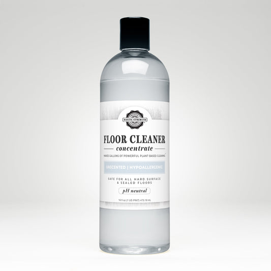 Rustic Strength unscented floor cleaner concentrate in 16 oz plastic bottle with flip-top spout, ready for effective floor cleaning.