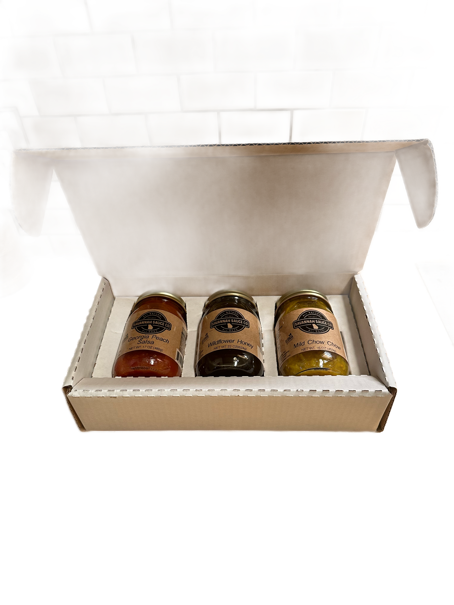 Three custom Mason jars with personalized branding on shippers, ideal for gift packaging, by SavannahSauceCompany.