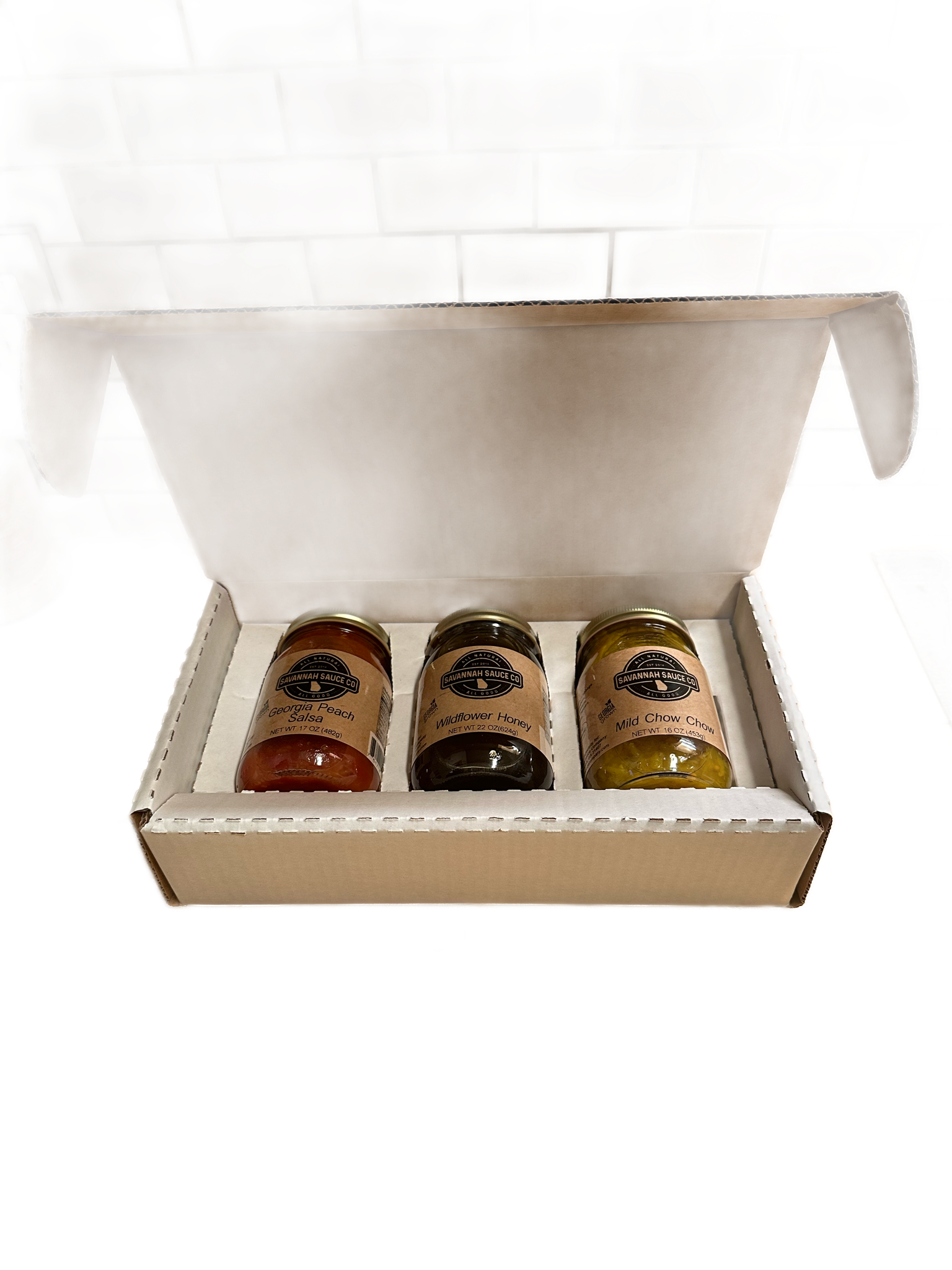 Three custom Mason jars with personalized branding on shippers, ideal for gift packaging, by SavannahSauceCompany.