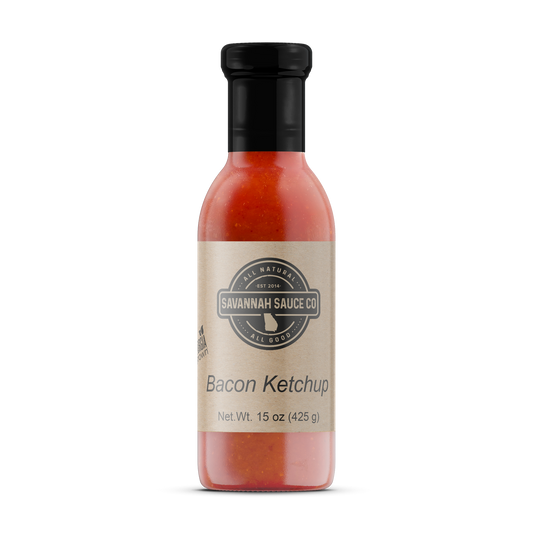 12 bottles of SavannahSauceCompany Bacon Ketchup, gourmet sauce with bacon flavor in 16 oz bottles arranged in a case.