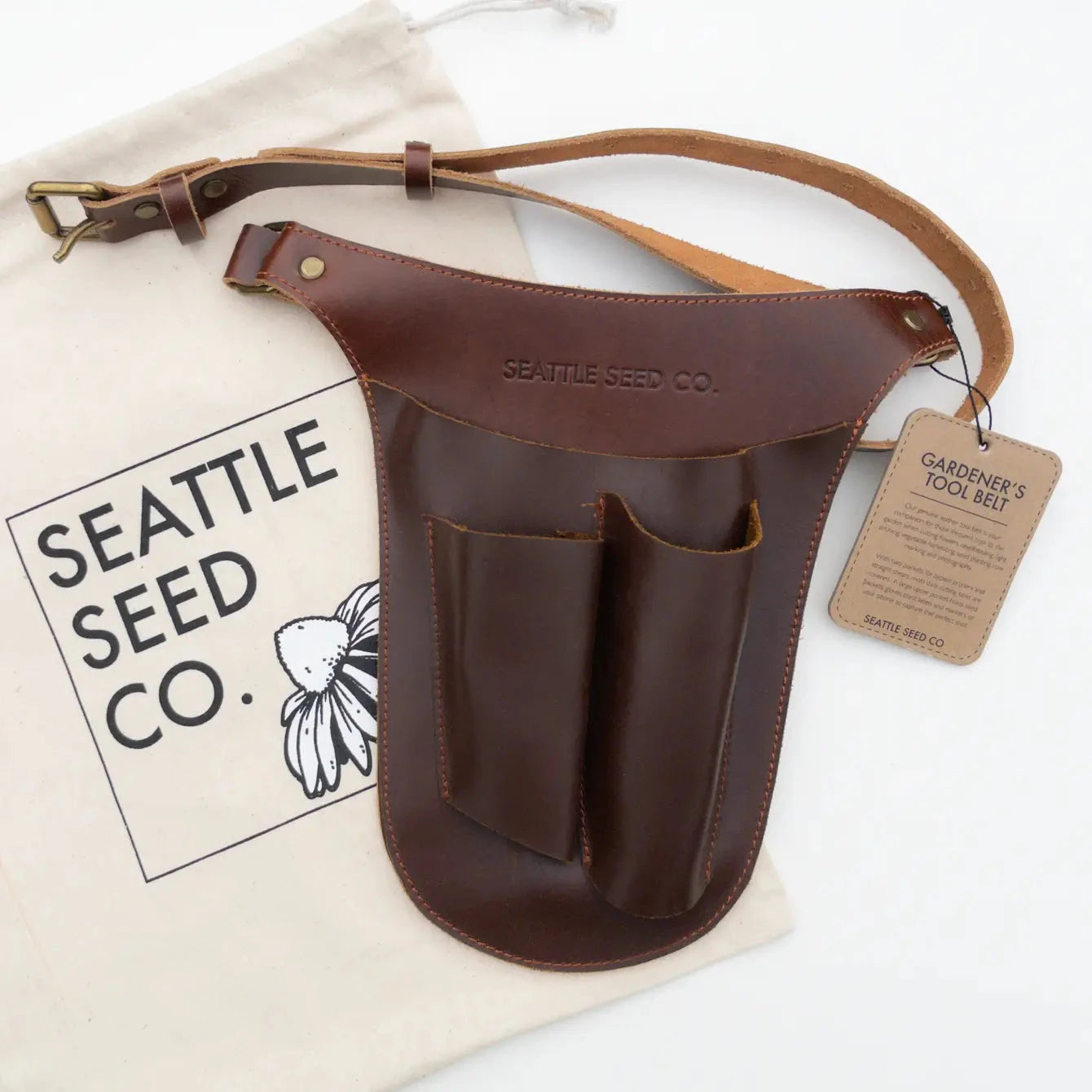 Genuine leather gardener's tool belt from Harvest Essentials by Seattle Seed Company, with multiple pockets and adjustable straps.