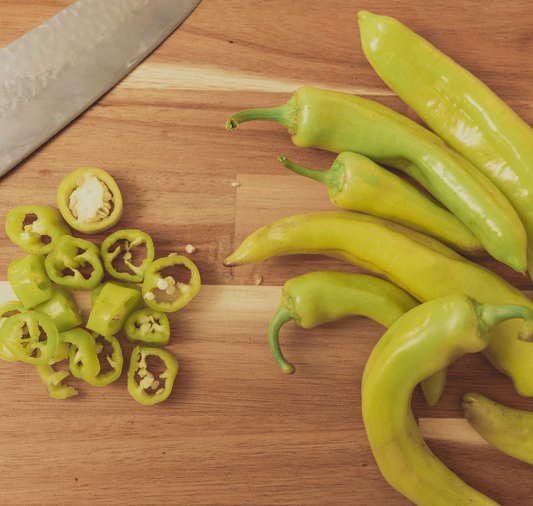 Packet of Seeds 'n Such Sweet Banana Pepper Seeds showing a colorful seed packet with 100 seeds for planting.