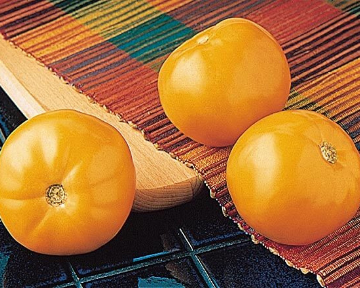 Packet of Carolina Gold Hybrid Tomato Seeds by Seeds 'n Such showing 15 to 20 seeds in a colorful seed packet.