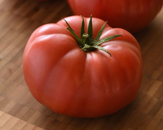 BlushingStar Hybrid Pink Beefsteak StLb Tomato Seeds from Seeds 'n Such in a packet for home gardening.