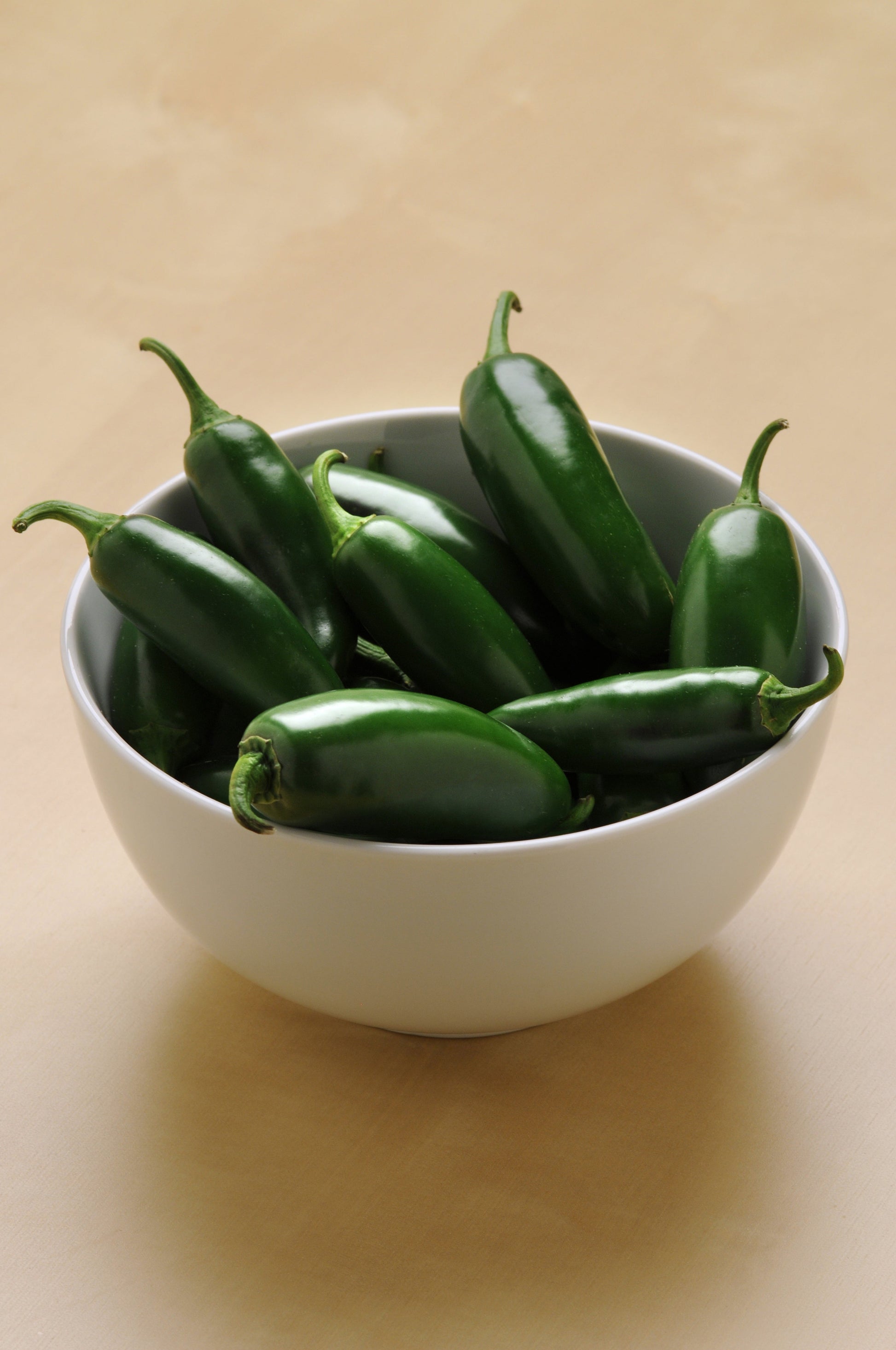 Packet of La Bomba Hybrid Pepper Seeds by Seeds 'n Such showing 8 to 10 seeds on a white background.