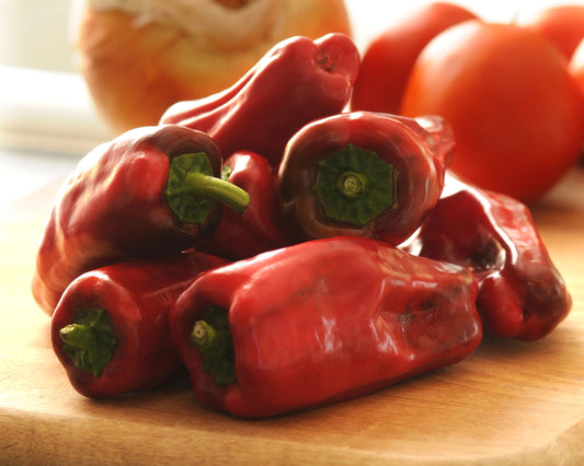 Packet of Sweet Heat Hybrid Bell Pepper Seeds by Seeds 'n Such, showing 8 to 10 seeds inside a colorful packet.