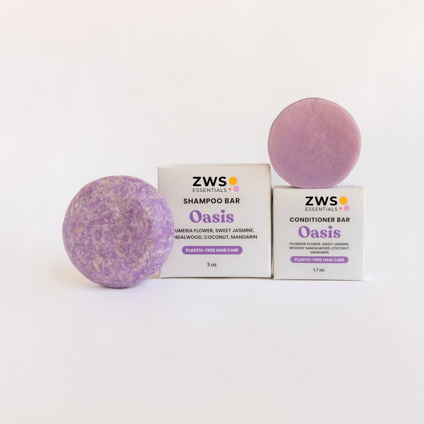 ZeroWasteStore.com shampoo and conditioner bar duo with Oasis scent, showcasing eco-friendly bars in a natural setting.
