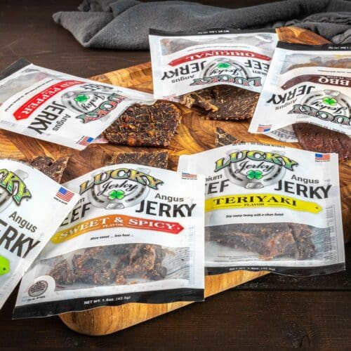 Thin beef jerky slab from Nebraska Star Beef, 1.5 oz, with visible marbling and seasoned surface, ideal for snacking.