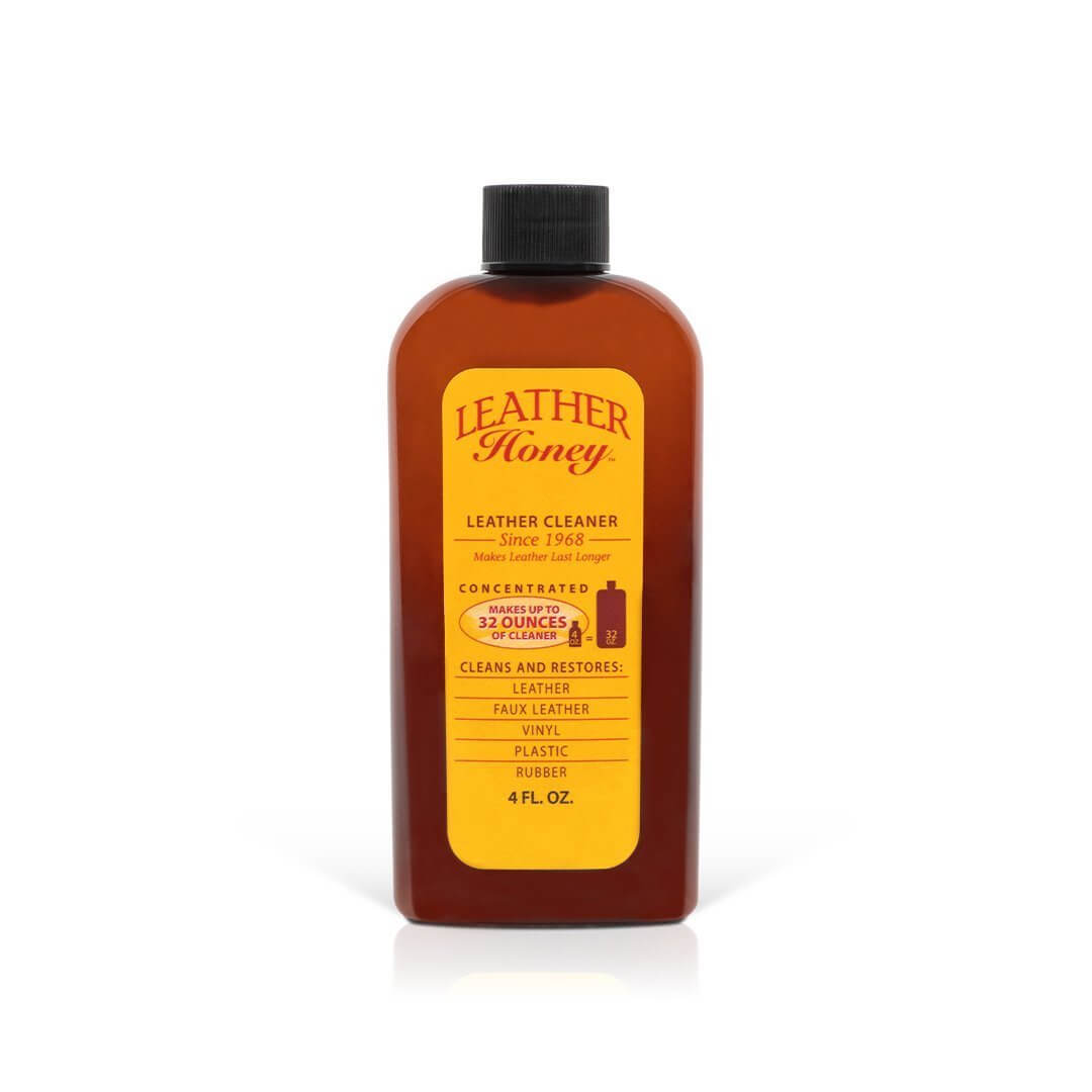 Leather Honey large leather care kit with bottles of cleaner and conditioner, brushes, and applicators for leather maintenance.