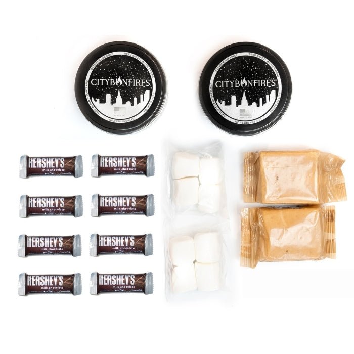 City Bonfires S'mores Family Pack outdoors set with marshmallows, graham crackers, and chocolate for camping or backyard fun.