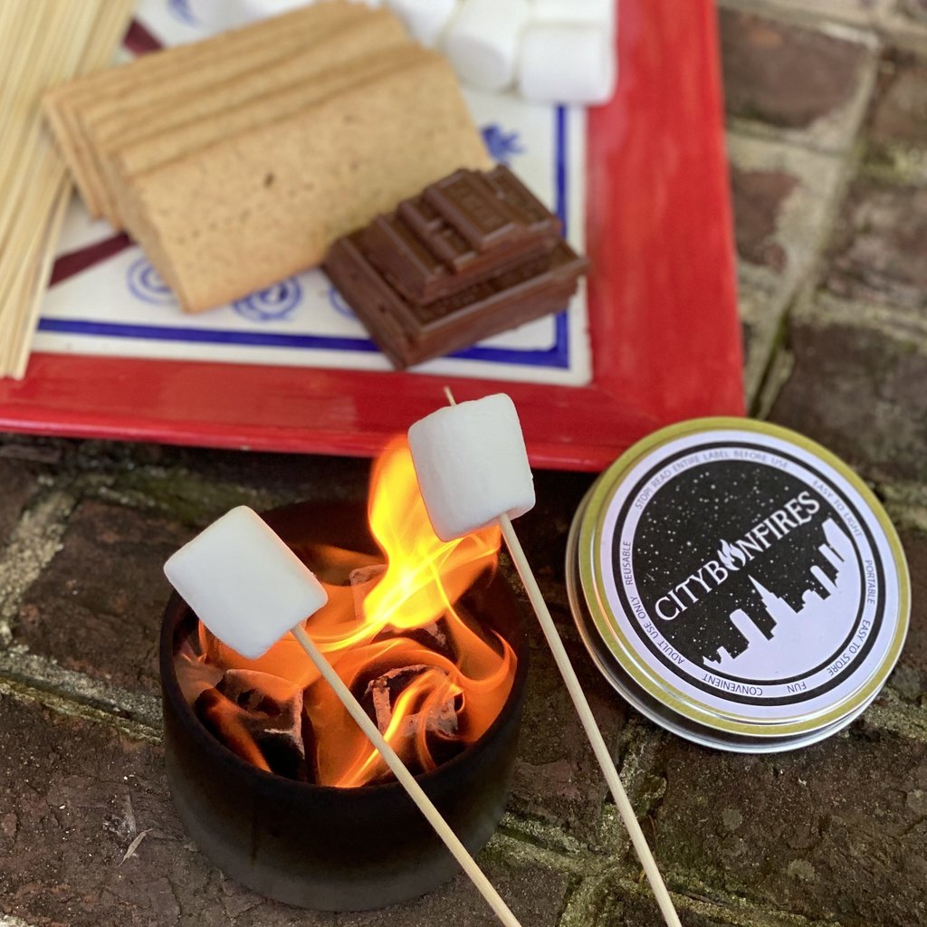 City Bonfires S'mores Family Pack outdoors, including marshmallows, chocolate, and graham crackers for making classic s'mores.