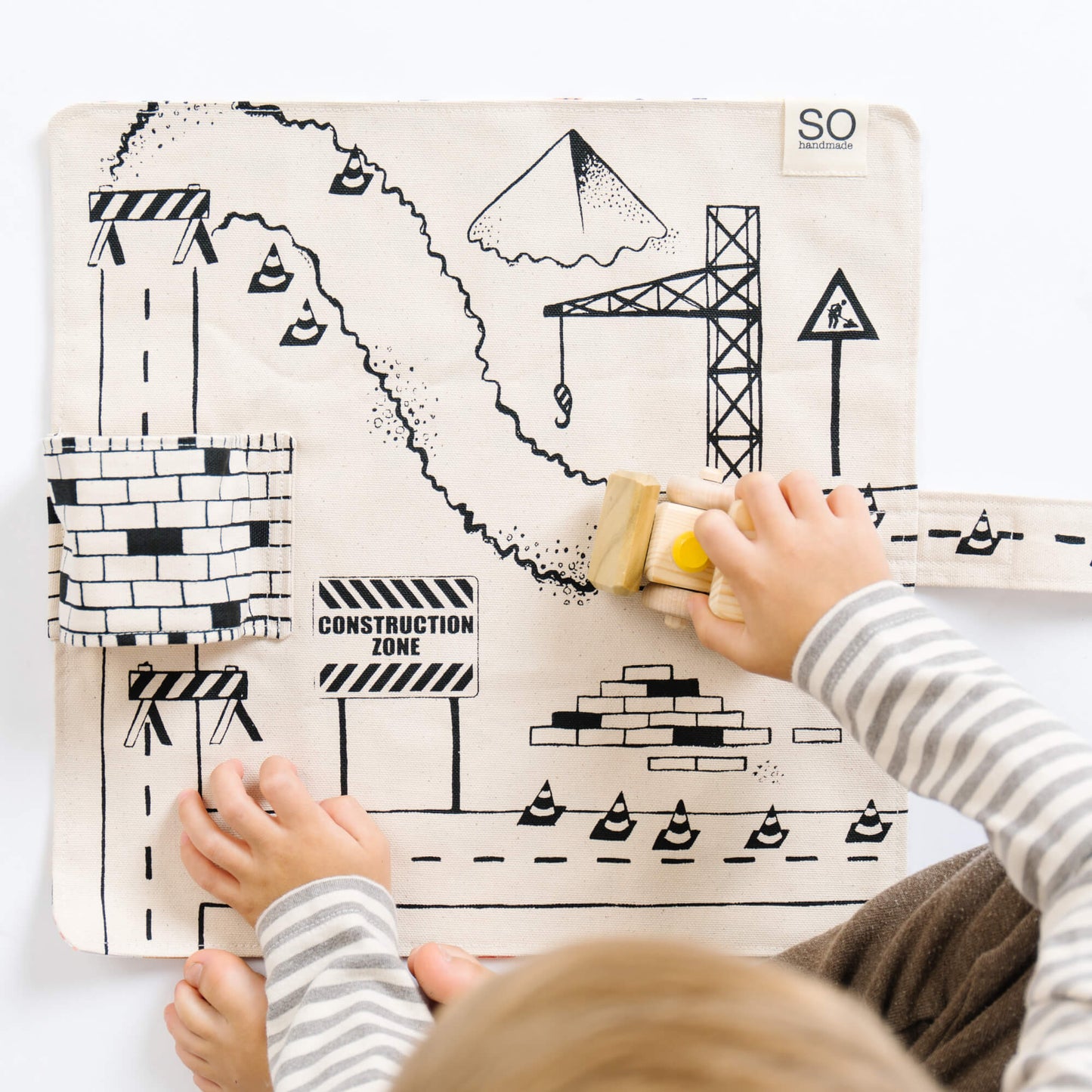 Construction playmat by So Handmade Shop featuring colorful construction vehicles, ideal for little builders and imaginative play.