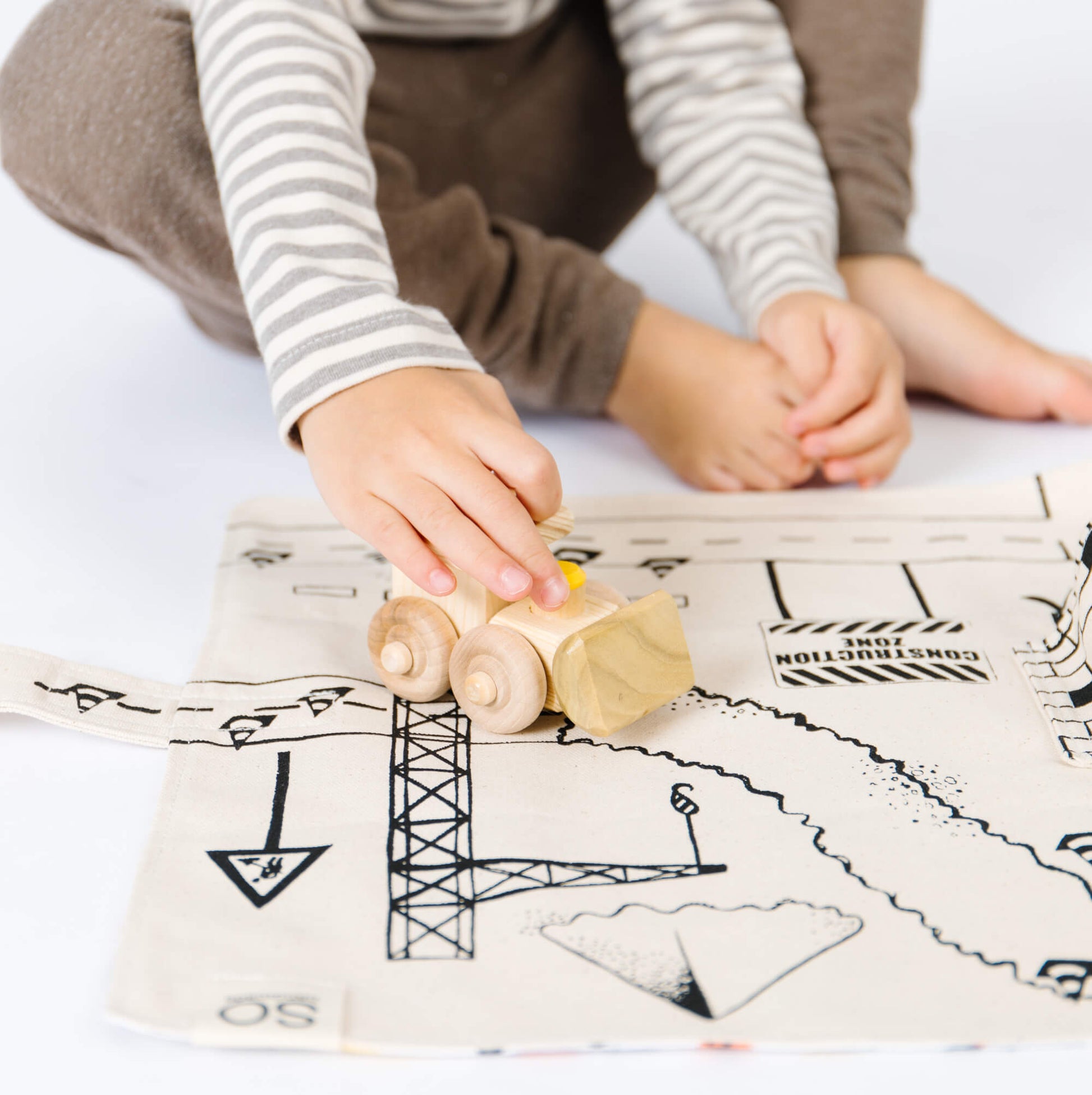 Colorful construction playmat by So Handmade Shop featuring construction vehicles, perfect for little builders' imaginative play.