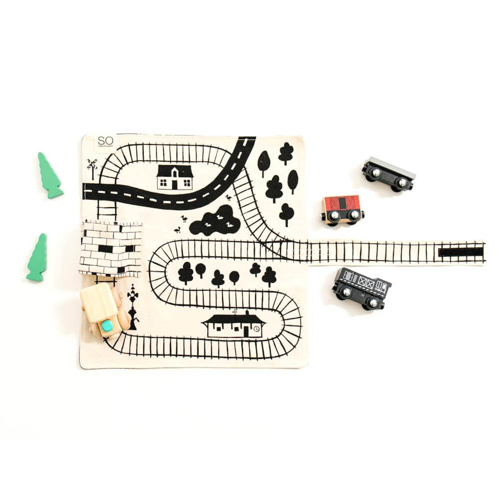 Wooden train playmat for toddlers by So Handmade Shop with portable train tracks, ideal for travel and imaginative play.