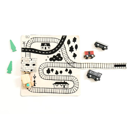 Wooden train playmat for toddlers by So Handmade Shop with portable train tracks, ideal for travel and imaginative play.