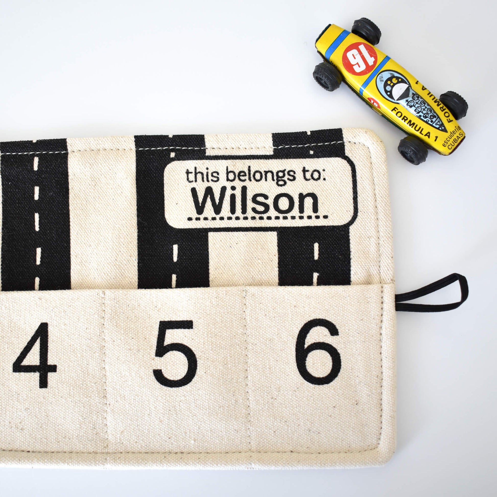Colorful toy car storage playmat by So Handmade Shop, designed to keep toy cars organized at home or on the go.