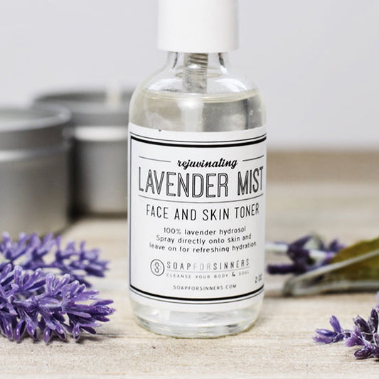 2oz Lavender Mist hydrosol bottle from Soap for Sinners with lavender-colored label and clear spray nozzle.