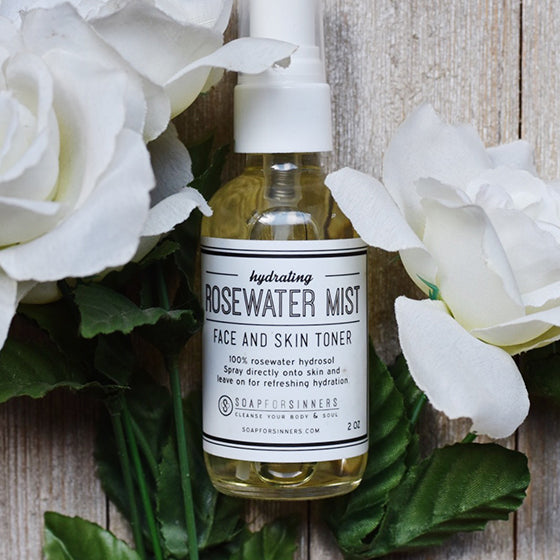 2oz Soap for Sinners Rosewater Mist hydrosol bottle with a clear label and spray nozzle, fresh and floral skincare product.