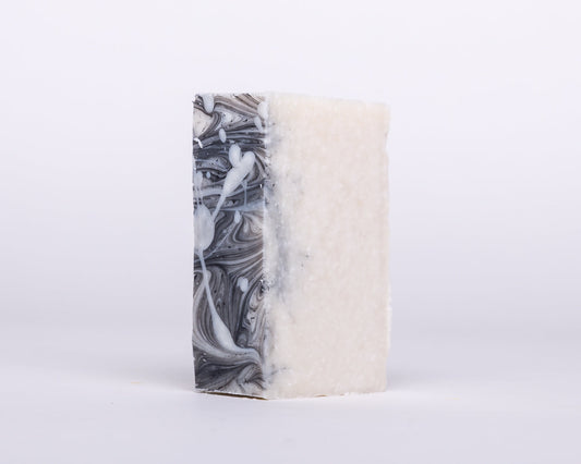 Soap for Sinners Pumice Microdermabrasian soap bar showing textured surface and branding details.